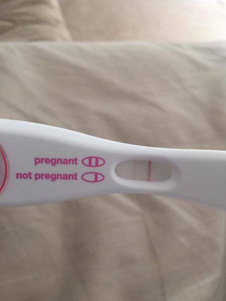 Original example photo of a pregnancy test with its whole reading window visible